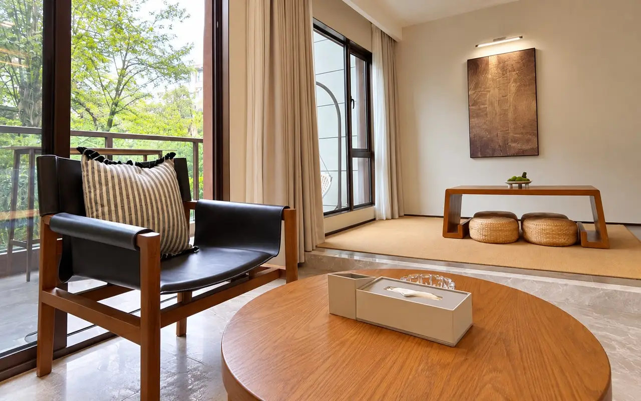 Aurora Loft sitting corner with an armchair, low table and floor cushions at the premium fat camp in China